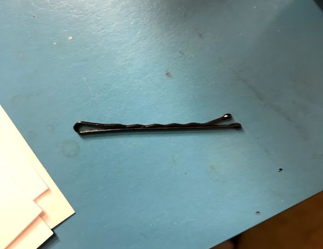 A black bobby pin.