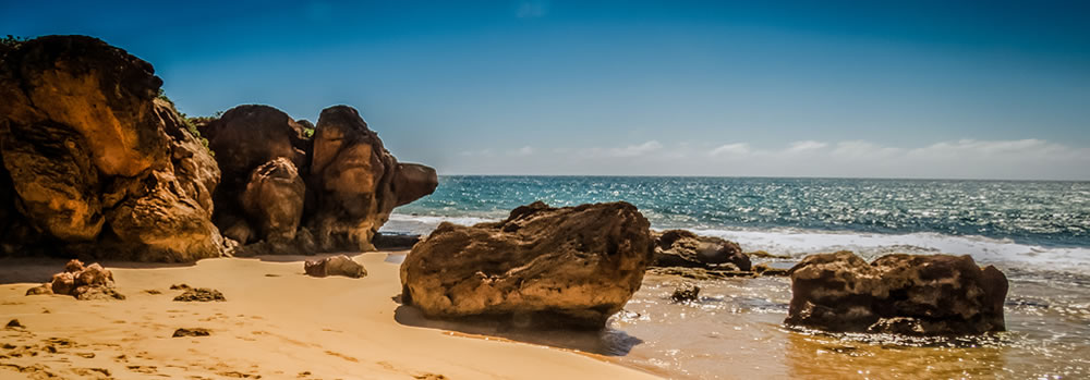 A beautiful sandy beach on the ocean.